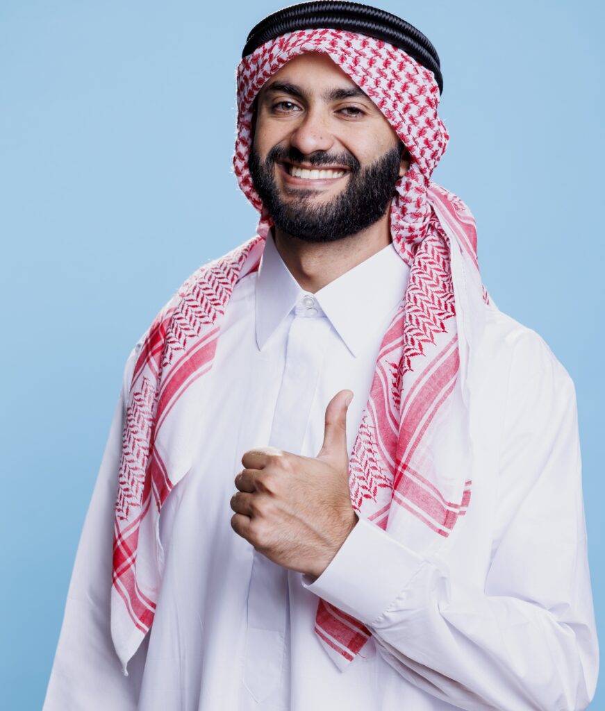 Arab in traditional robe with thumb up