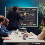 Business team collaborating on corporate culture initiatives development, discussing values alignment and cultural integration efforts to strengthen organizational identity and cohesion. Camera B.